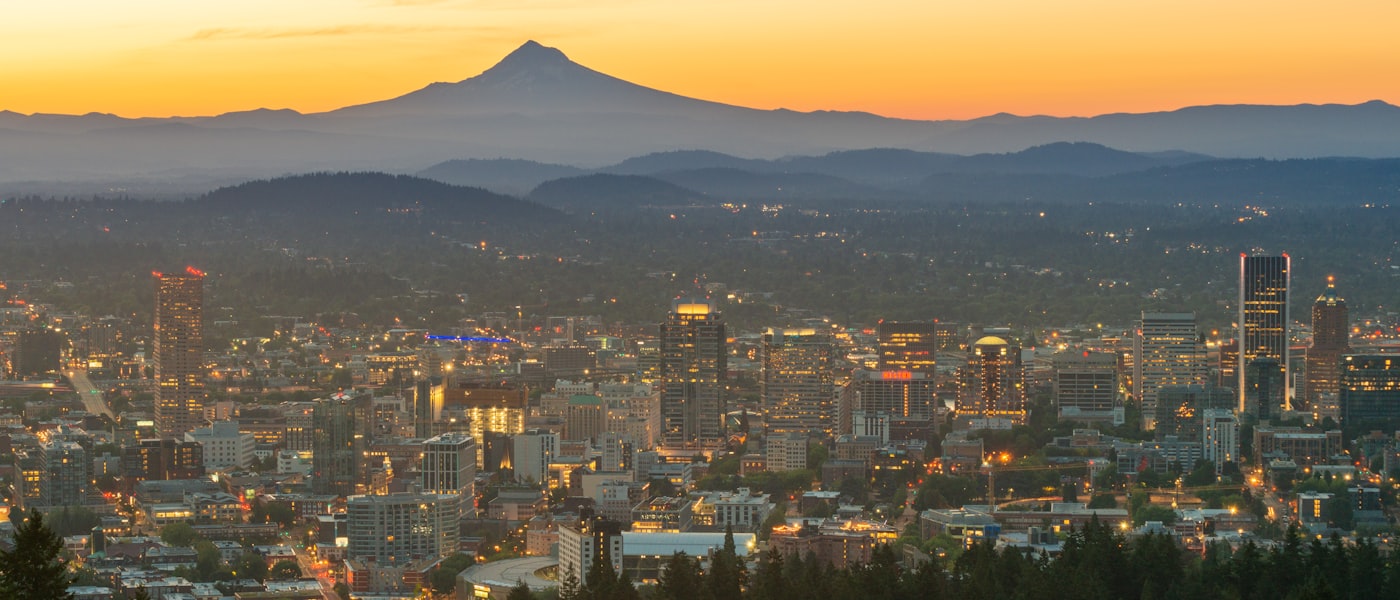 Portland Oregon skyline at sunset with Mount Hood
